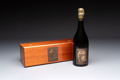 A bottle of Cuvée Spéciale Louise Pommery Vintage 1980 Champagne, presented in a commemorative box fitted with a bronze plaque