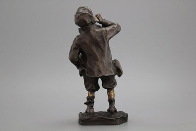 A bronze figure of a young boy, signed Louis Oury