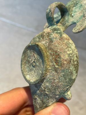 A bronze urn, a bronze canteen with relief design and a pair of bronze oil lamps, Etruscan and Roman civilizations, 9th C. B.C/5th C. — photo 13