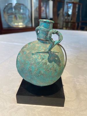A bronze urn, a bronze canteen with relief design and a pair of bronze oil lamps, Etruscan and Roman civilizations, 9th C. B.C/5th C. — photo 15