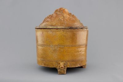 A brown-glazed pottery tripod vessel and mountain cover, Han Dynasty (206 BC-220 AC)
