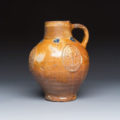 A brown-glazed stoneware jug with the arms of Van Stepradt, Southern Netherlands, dated 1633