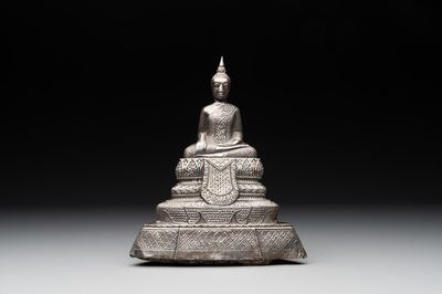 A Cambodian silver repoussé Buddha with inscription, 19th C.