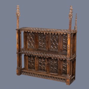 A carved oak shelf with pinnacles and stylised flowers and carved panels, 15th C. and later — photo 1