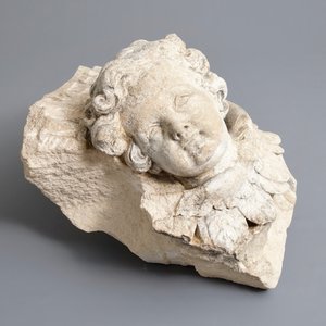 A carved stone wall fragment of a cherub's head with wing, 17/18th C. — 照片 2