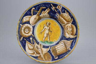 A Casteldurante maiolica plate with Cupid holding an arrow, dated 1560