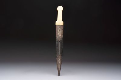 A Caucasian gilt Damascus steel 'Khinjal' with a whale bone hilt and a leather and damascened steel scabbard, 19th C.