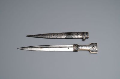 A Caucasian walrus bone-hilted kindjal with niello silver mounts, 19th C.