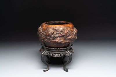 A Chinese agarwood brush washer with landscape relief design on wooden stand, 17/18th C.