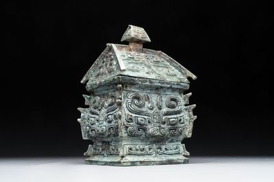 A Chinese archaic bronze inscribed wine vessel with buffalo design, 'fangyi 方彝', Western Zhou