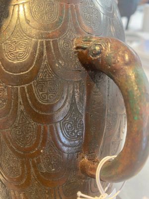 A Chinese archaic bronze inscribed wine vessel with scale design, 'hu 壺', Zhou — photo 29