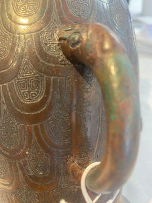 A Chinese archaic bronze inscribed wine vessel with scale design, 'hu 壺', Zhou — photo 30