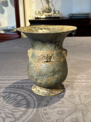 A Chinese archaic bronze ritual wine vessel with buffalo heads, 'zhi 觯', Western Zhou — photo 1