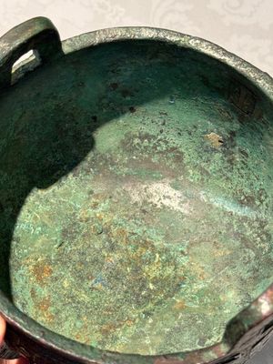 A Chinese archaic bronze tripod food vessel with 'taotie' design, 'ding 鼎', Western Zhou — photo 12
