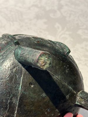 A Chinese archaic bronze tripod food vessel with 'taotie' design, 'ding 鼎', Western Zhou — photo 6