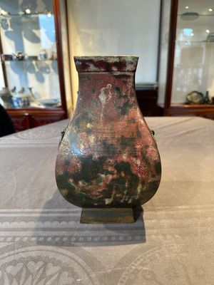 A Chinese archaic bronze vase with 'Taotie' handles, 'fang hu 方壺', Han — photo 1