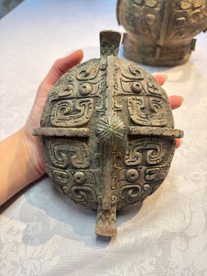 A Chinese archaic bronze wine vessel and cover with Taotie design, You 卣, late Shang — photo 12