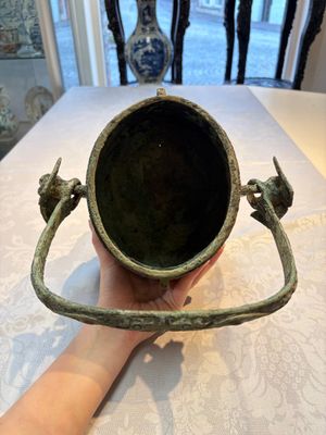 A Chinese archaic bronze wine vessel and cover with Taotie design, You 卣, late Shang — photo 6