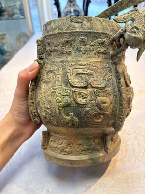 A Chinese archaic bronze wine vessel and cover with Taotie design, You 卣, late Shang — photo 10