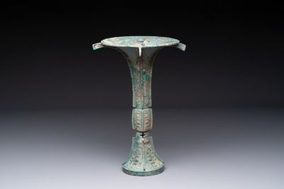 A Chinese archaic bronze wine vessel with 'taotie' design, 'gu 觚', Shang