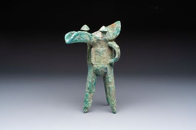 A Chinese archaic bronze wine vessel with Taotie design, Jue 爵, late Shang