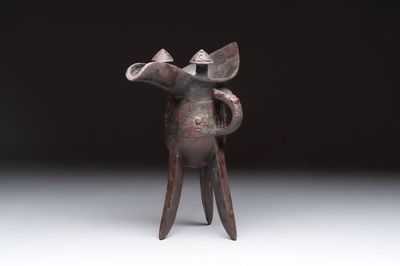 A Chinese archaic bronze wine vessel with Taotie design, 'Jue 爵', Zhou