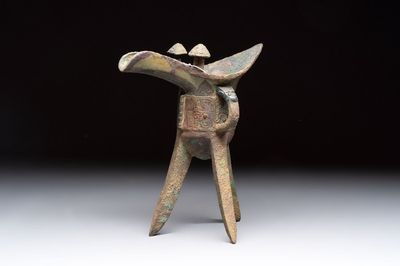 A Chinese archaic bronze wine vessel with taotie design, 'jue 爵', Zhou