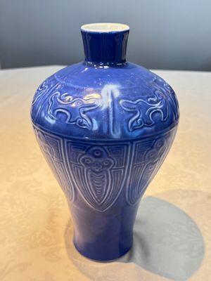 A Chinese archaistic blue-glazed vase with relief design, 20th C. — photo 1