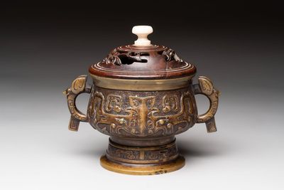 A Chinese archaistic bronze censer with a wooden cover, Xuande mark, 19th C.