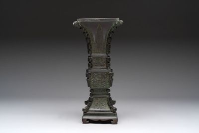 A Chinese archaistic bronze 'gu' vase and stand, Qing