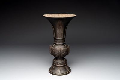 A Chinese archaistic bronze 'gu' vase with relief design, Ming