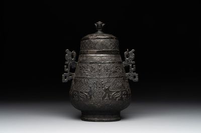 A Chinese archaistic bronze 'Taotie' wine vessel and cover, 'you 卣', Ming