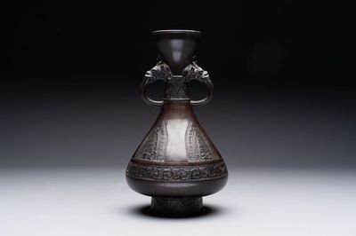 A Chinese archaistic bronze vase with dragon-form handles, Yuan/Ming