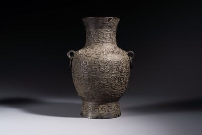 A Chinese archaistic bronze vase with Taotie handles, 'Hu 壺', Ming