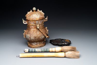 A Chinese archaistic bronze 'you 卣' vessel and cover, an inkstone and two calligraphy brushes, 20th C.