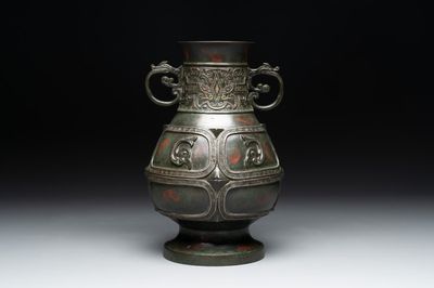 A Chinese archaistic gold- and silver-inlaid bronze vase with pseudo-rust patina, 19th C.