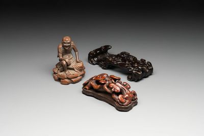 A Chinese bamboo figure of Luohan, a ruyi group on wooden stand and a hongmu stand, 19/20th C.