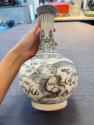 A Chinese black-enamelled biscuit 'Dragon' vase, Kangxi mark, 19th C. — photo 1
