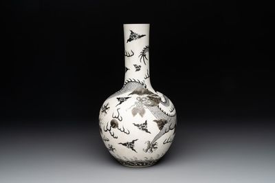 A Chinese black-enamelled biscuit 'dragon' vase, Qianlong mark, 19th C.