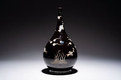 A Chinese black-glazed reverse-decorated bottle vase, 20th C.