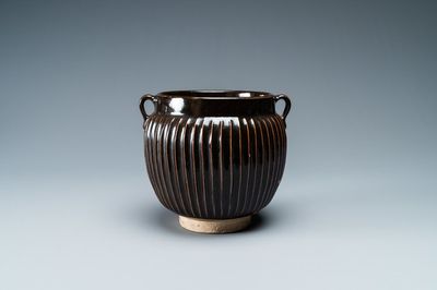 A Chinese black-glazed ribbed two-handled jar, Northern Song or Jin
