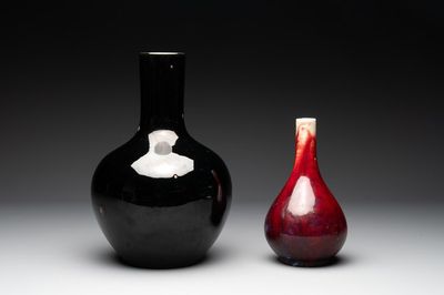 A Chinese black-glazed 'tianqiu ping' vase and a flambé-glazed bottle vase, 19/20th C.