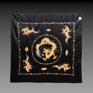 A Chinese black-ground embroidered silk panel with a four-clawed dragon, 19th C. — photo 1
