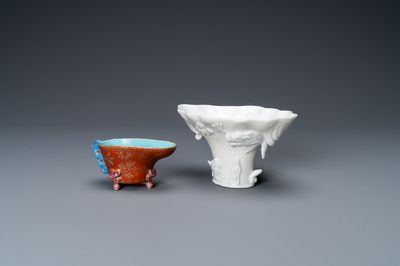 A Chinese blanc de Chine libation cup and a gilt-decorated coral-ground one, Kangxi and 19th C.