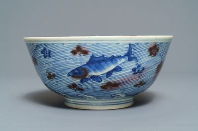 A Chinese blue and underglaze red bowl with carps and marine animals, Xuande mark, Kangxi