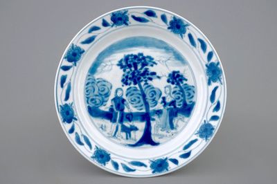 A Chinese blue and white "Adam and Eve" saucer dish, Kangxi