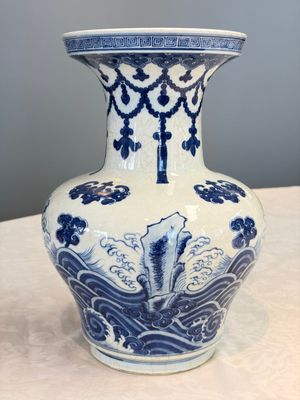 A Chinese blue and white 'Bats and Rocks among Cresting Waves' vase, Qianlong — photo 1