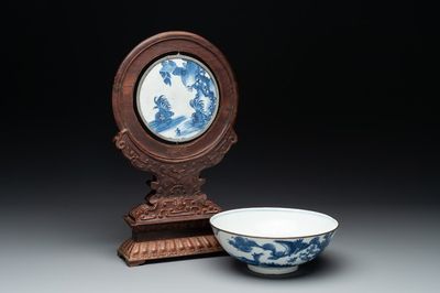 A Chinese blue and white 'Bleu de Hue' 'roosters and chick' plaque in a carved wooden screen and a bowl, 19th C.
