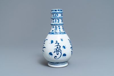 A Chinese blue and white bottle vase, Kangxi mark, 19th C.