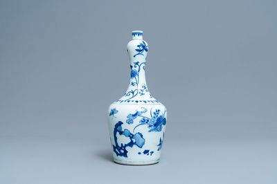 A Chinese blue and white bottle vase with floral design, Transitional period